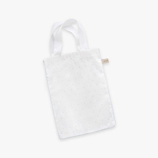 White tote bag with blue polka dot pattern on a white background