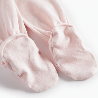 Pink footies on a white background