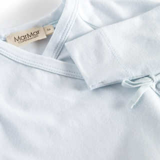 Blue Baby garment with a bow tie and a visible brand tag on a light background