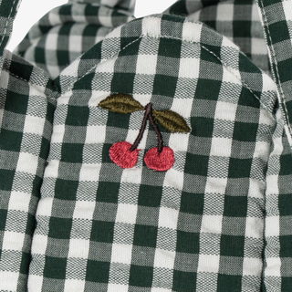 Green and white checkered  with embroidered cherries on a white background