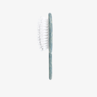 Baby blue hairbrush on a white background