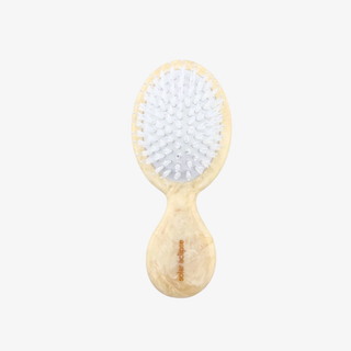 Baby hairbrush with soft bristles on a white background
