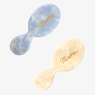 Two baby hairbrushes with 'Mama' text on a white background