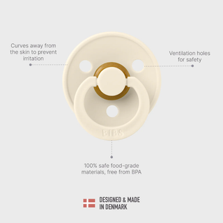 Beige pacifier with text highlighting features on a light gray background