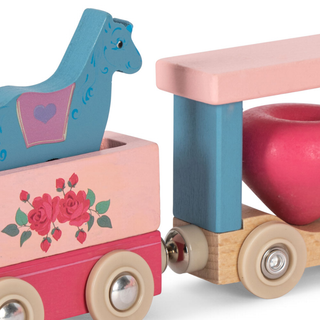 Wooden toy with a blue horse figure and pink and red floral design on a white background