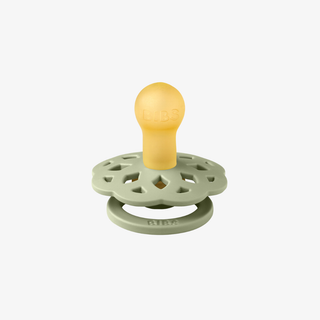 Sage green and yellow baby pacifier on a white background