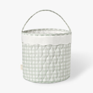 Quilted fabric basket with a green checkered pattern on a white background