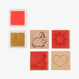Set of six rubber stamps with different designs on a white background