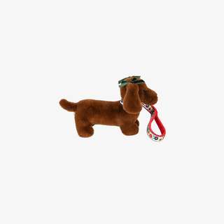 Brown plush dog toy with a colorful handle on a white background