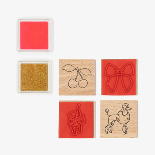 Set of six rubber stamps with different designs on a white background