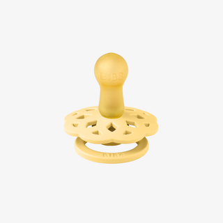Yellow baby teether on a white background
