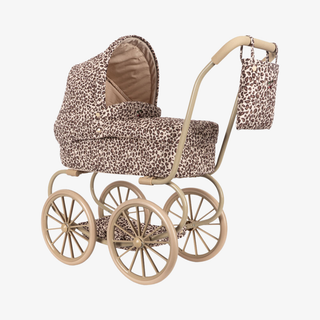 Leopard print baby stroller with matching bag on a white background