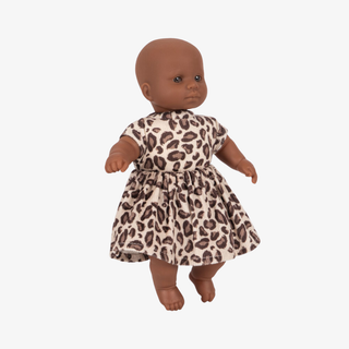 Doll wearing a leopard print dress on a white background