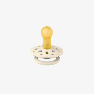 White pacifier with a natural rubber nib on a white background