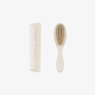 White comb and brush on a white background