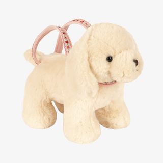 A cream-colored plush dog purse with a pink patterned strap handle, shown against a plain white background.