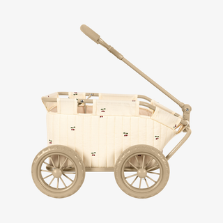 A cream-colored fabric stroller basket with a beige metal frame, handle, and spoked wheels, shown against a plain light gray background.