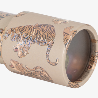 A close-up of a kaleidoscople covered in a beige print featuring multiple tiger illustrations. The product is shown against a plain white background.