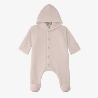 A pale pink nude baby footed one-piece romper with a hood and front snap buttons, shown against a plain white background.