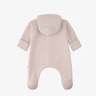 A baby footed one-piece romper shown from the back, in a soft dusty pink nude color, on a clean white background.