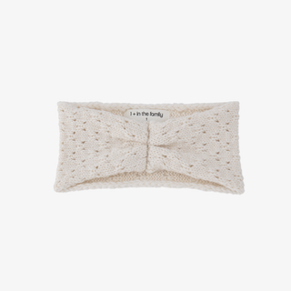 An ecru-colored knit baby's headband with a central scrunched detail shown against a plain white background.