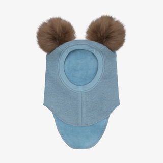 A blue child's balaclava with two fluffy pom-poms on the top, shown against a plain light gray background.