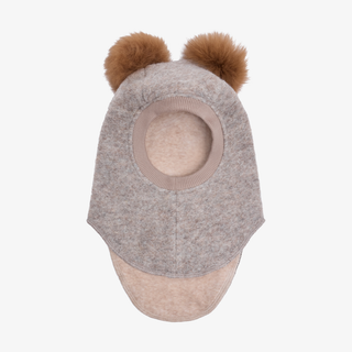 A light beige felt child's balaclava with two brown fur pom-pom on a white background.