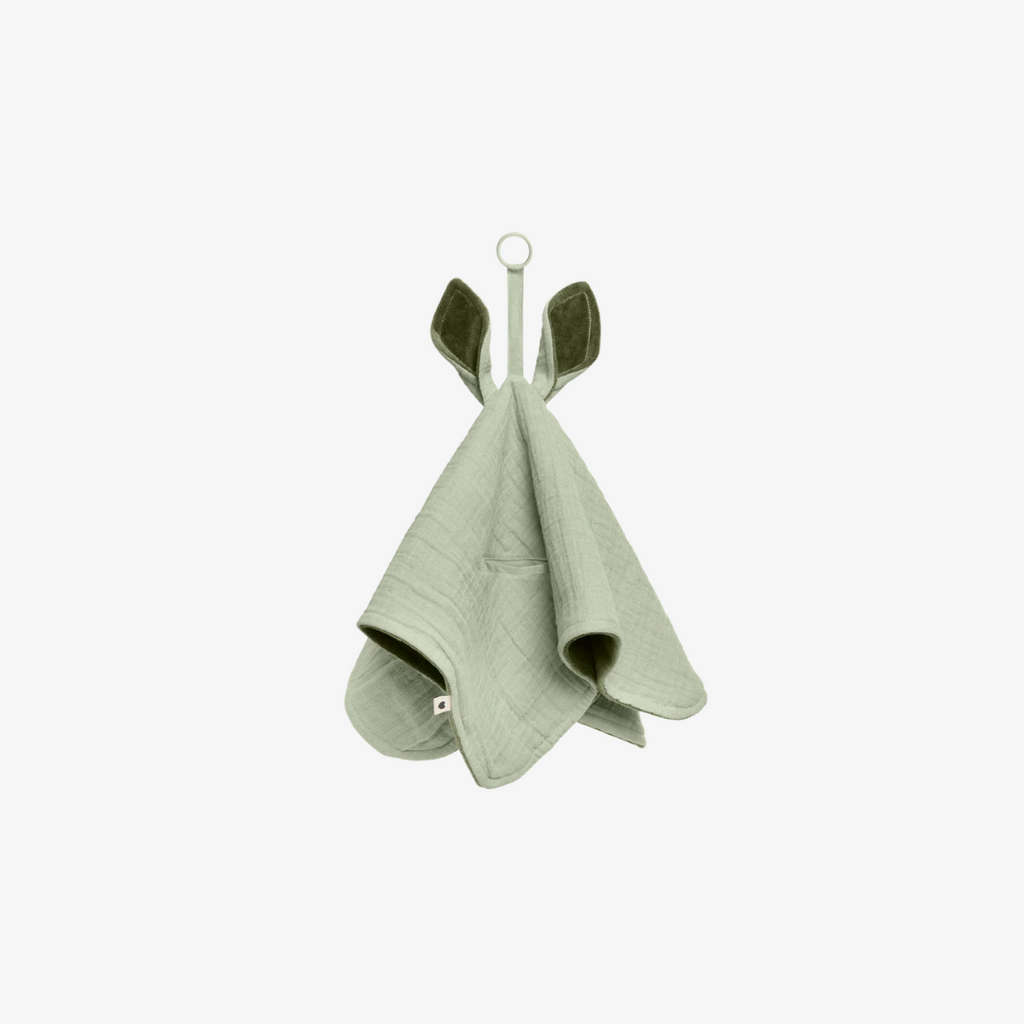 green baby blanket with green accents on a white background