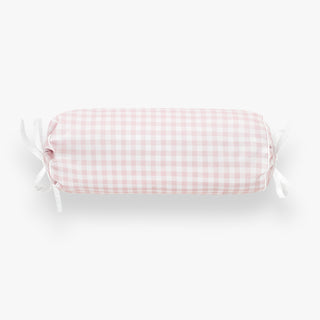 bolster pillow with pink gingham pattern on a white background