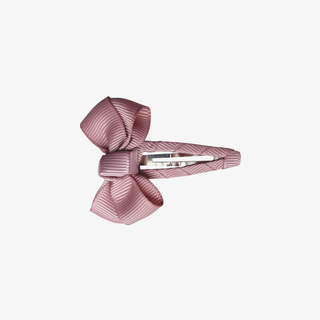 Pink hair bow with a clip on a white background