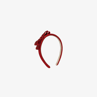 Red headband with a bow on a white background