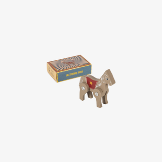 Wooden horse toy with a box on a white background
