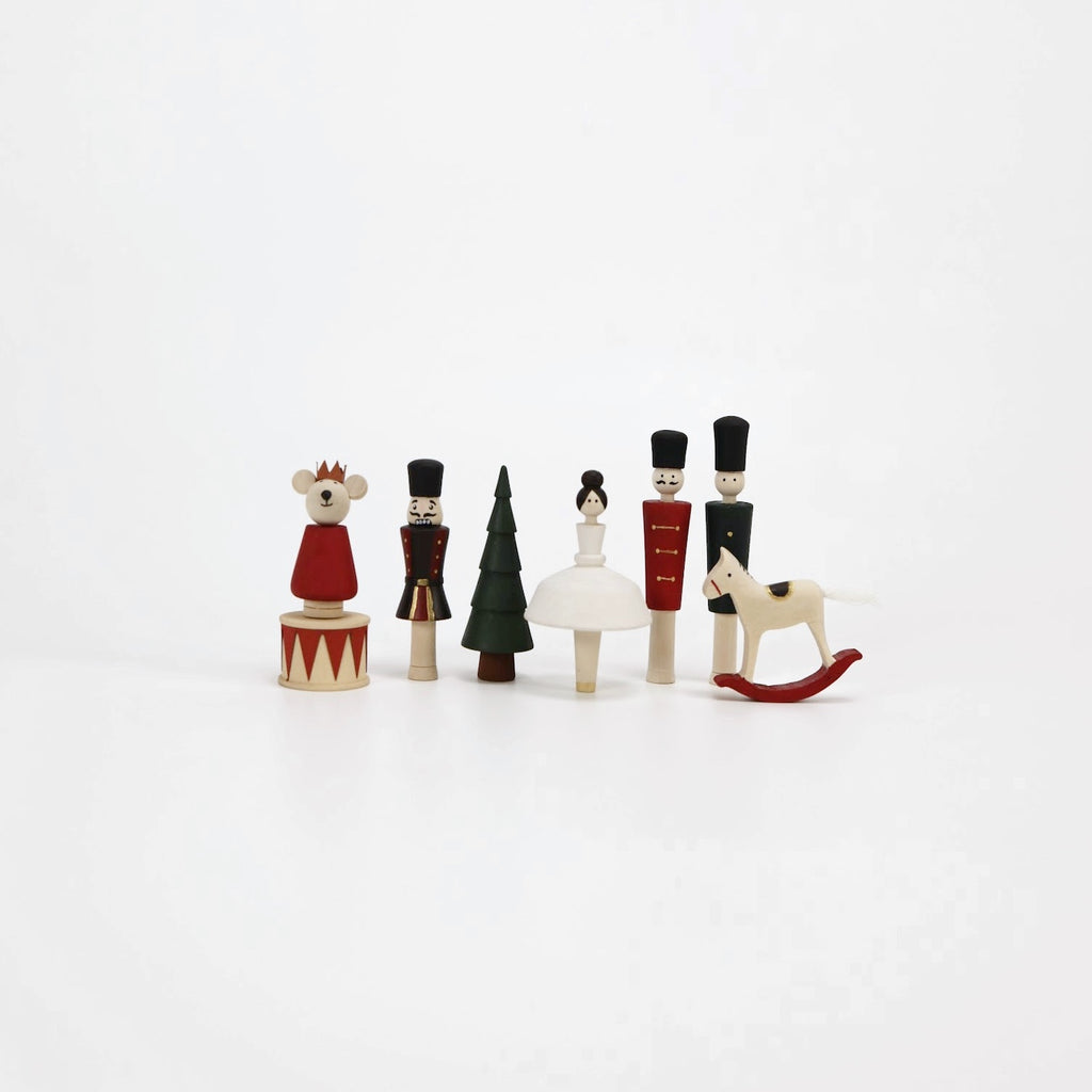 8 hand-painted figures: ballerina, nutcracker, red soldier, green soldier, mouse, rocking horse, drum, and Christmas tree.