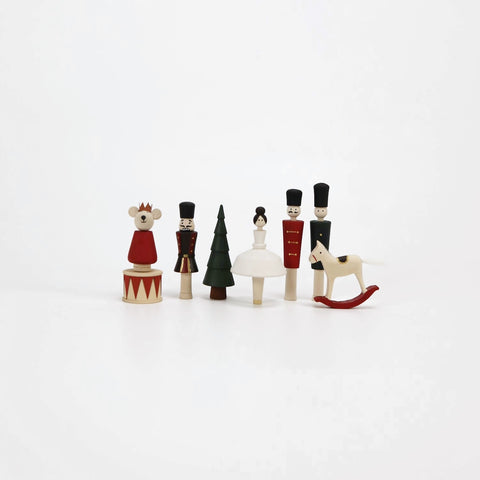 8 hand-painted figures: ballerina, nutcracker, red soldier, green soldier, mouse, rocking horse, drum, and Christmas tree.