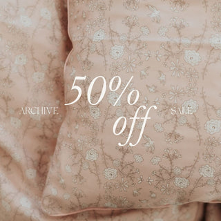 Floral patterned fabric with '50% off' text overlay