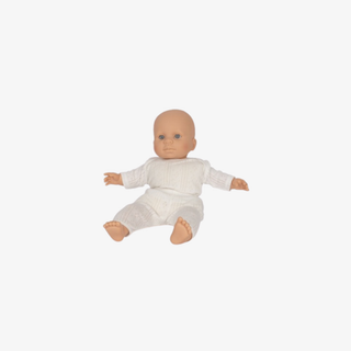 Baby doll in a white outfit on a white background