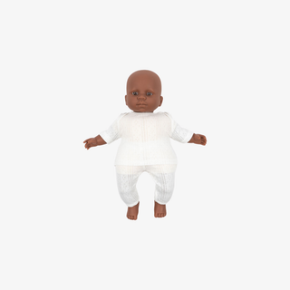 Baby doll with brown skin wearing a white onesie on a white background