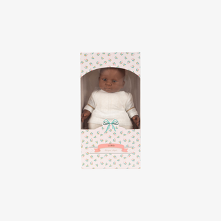 Baby doll in a decorative box on a white background