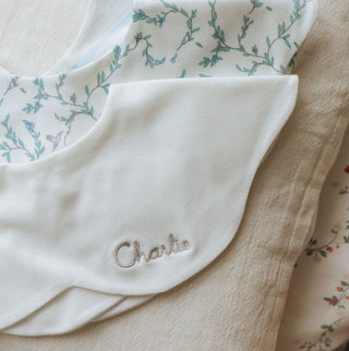 Winglet Bib in Ivory monogramed with child's name