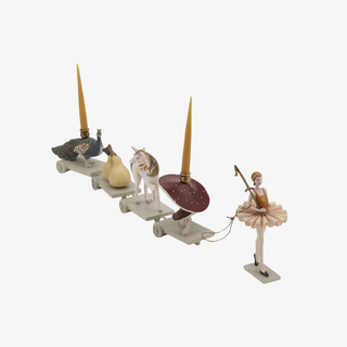 Decorative set with a ballerina, animals, and candles on a white background