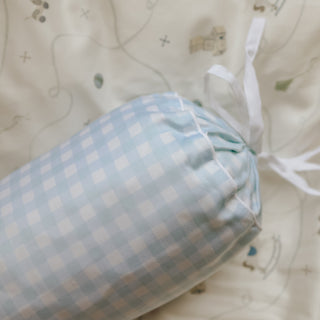 picnic gingham blue bolster pillow on a patterned blanket