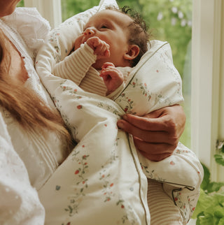 Botanical Berries Baby Duvet wrapped around baby in mothers arms