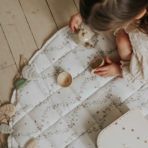 Botanical Berries Play Mat with girl playing on in with tea set