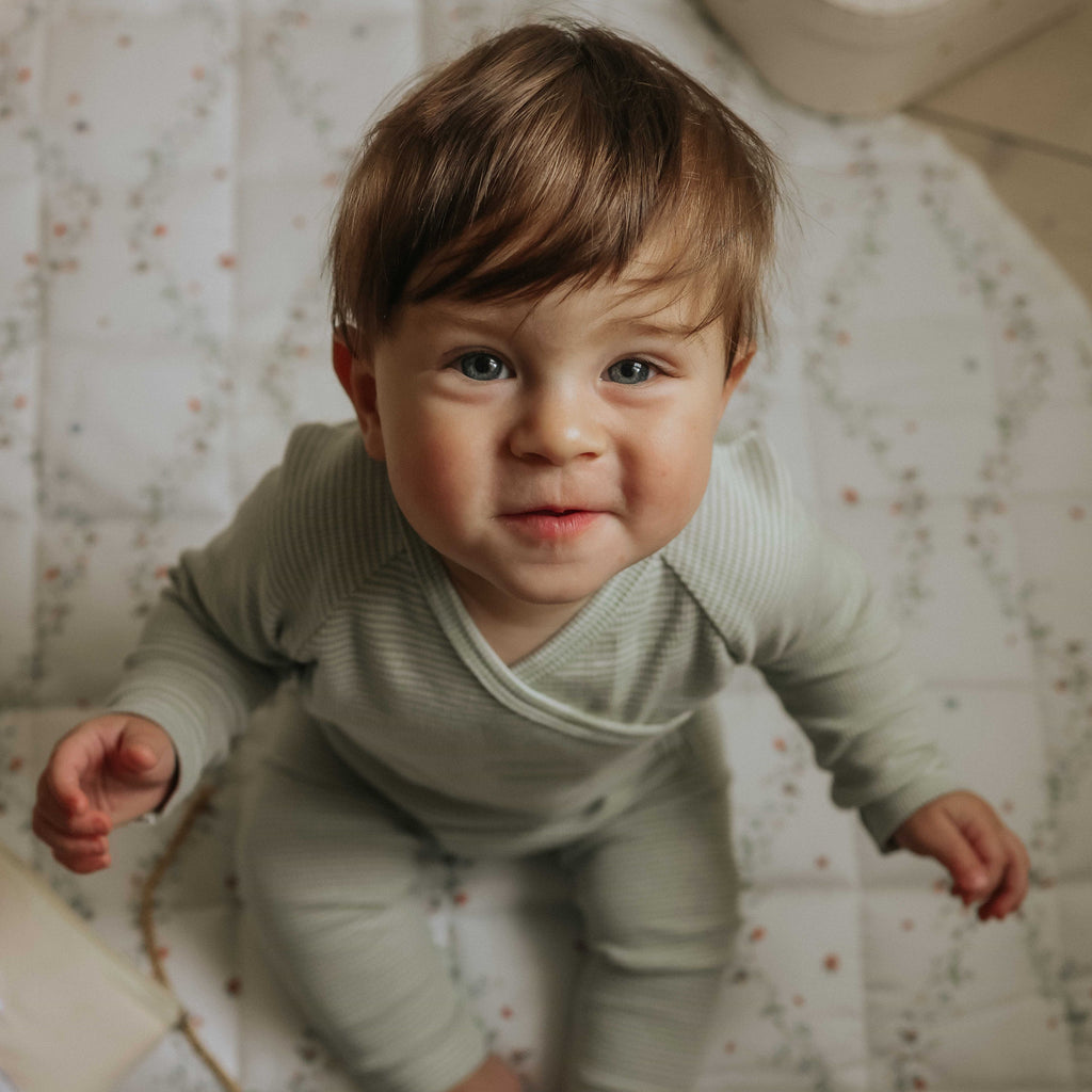 Botanical Berries Play Mat with baby boy sitting on top