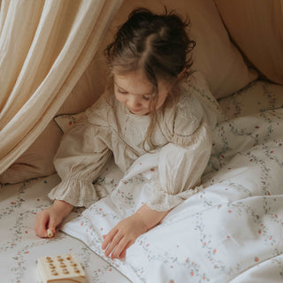 Botanical Berries Toddler Duvet with Toddler Girl laying in bed