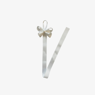 White ribbon hairbow holder with a bow on top