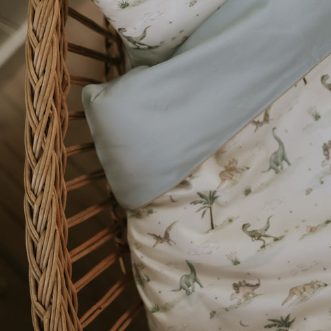 Dino Dreams Baby Duvet in Sage in bassinet