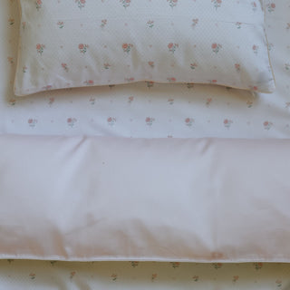 Floral patterned bedding set with a pillow and duvet cover.