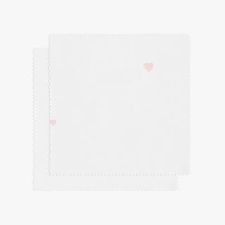 White fabric with pink heart pattern on a white background