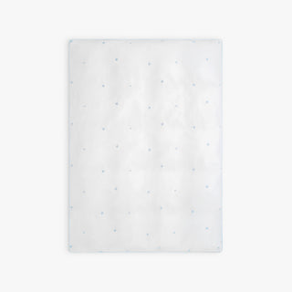 White toddler duvet with embroidered blue star pattern on a white background